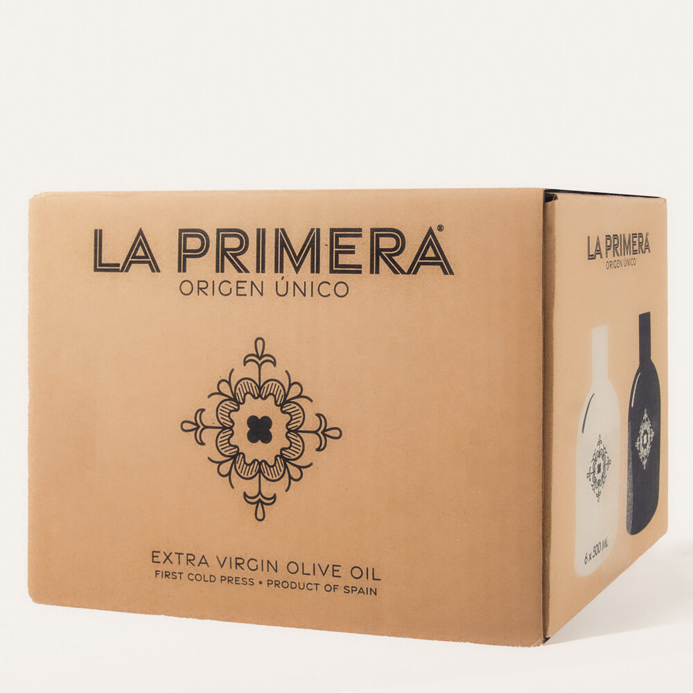 Cardboard box with 'LA PRIMERA' brand moniker and Spanish tile logo. Side of box shows two stylized bottle outlines with 'LA PRIMERA' logo and reads 6 by 500mL.